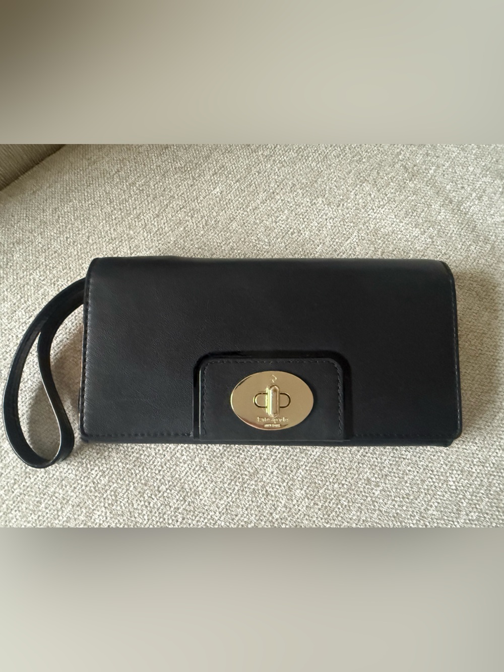 Kate Spade Black Wristlet with Striped Interior and Gold Logo